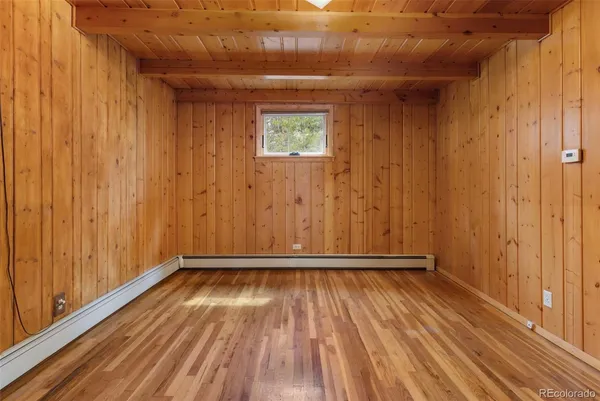 a view of a room with wooden floor