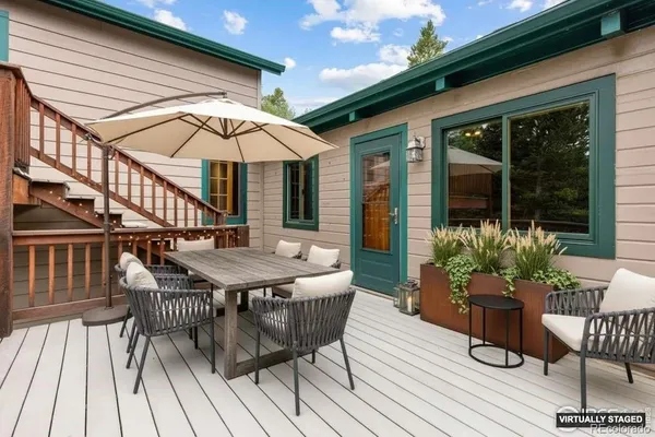 a view of a house with patio and wooden floor