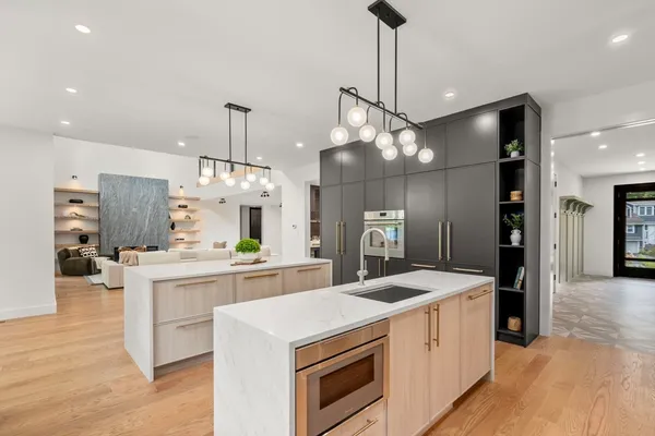 a kitchen with a sink and a stove top oven