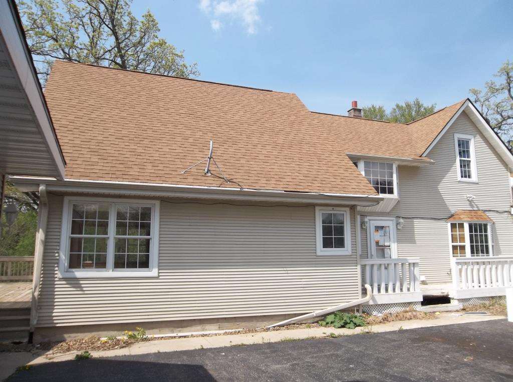8770 North Kilbuck Road Monroe Center, IL 61052 - Photo 6 of 18 a house with a outdoor space