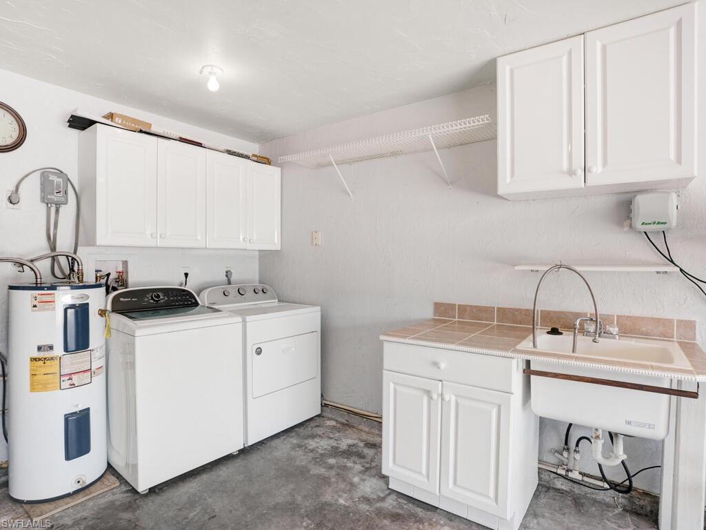 9101 Hamlin Road West Fort Myers, FL 33967 - Photo 24 of 24 a view of a kitchen with sink and washing machine