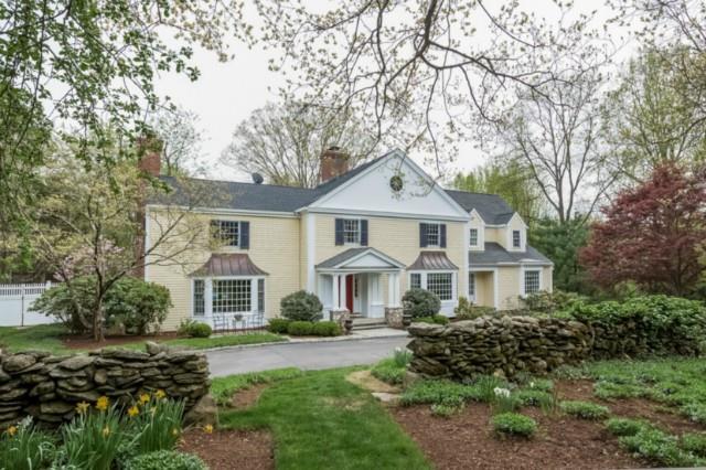 55 Ryders Lane Wilton, CT 06897 - Photo 1 of 1 a front view of a house with a yard