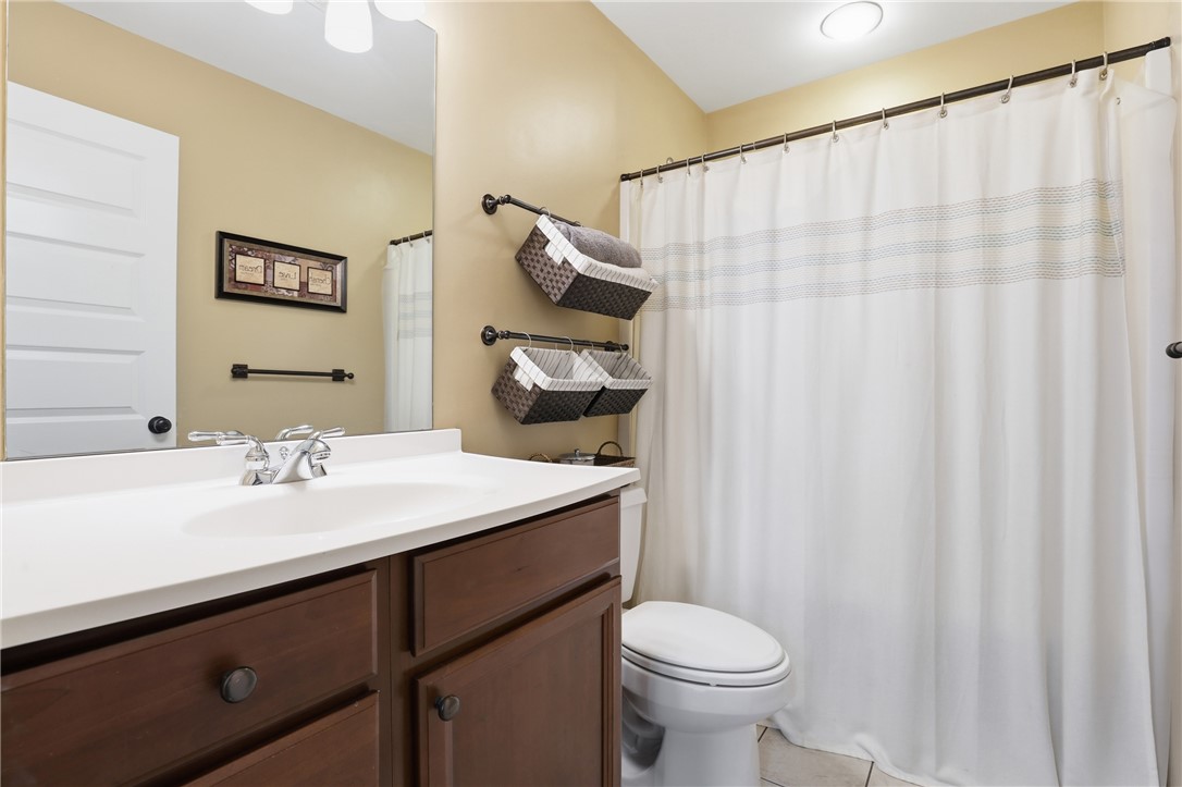 1110 Sunset Lane Anderson, SC 29626 - Photo 16 of 38 A pristine bathroom featuring a classic vanity, ample mirror, and well-appointed shower area.