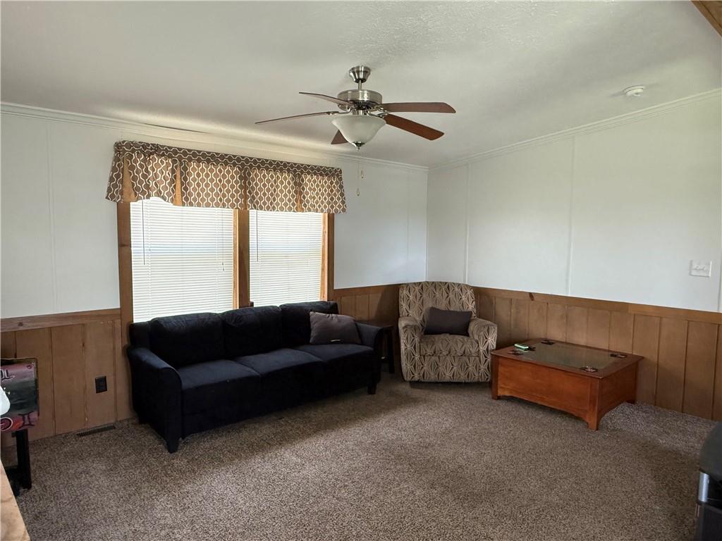 121 Rt 21 Mhp Carmichaels, PA 15320 - Photo 2 of 16 a living room with furniture and a ceiling fan