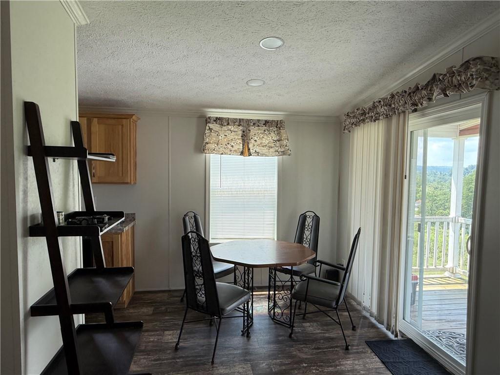 121 Rt 21 Mhp Carmichaels, PA 15320 - Photo 4 of 16 a view of a dining room with furniture and a window