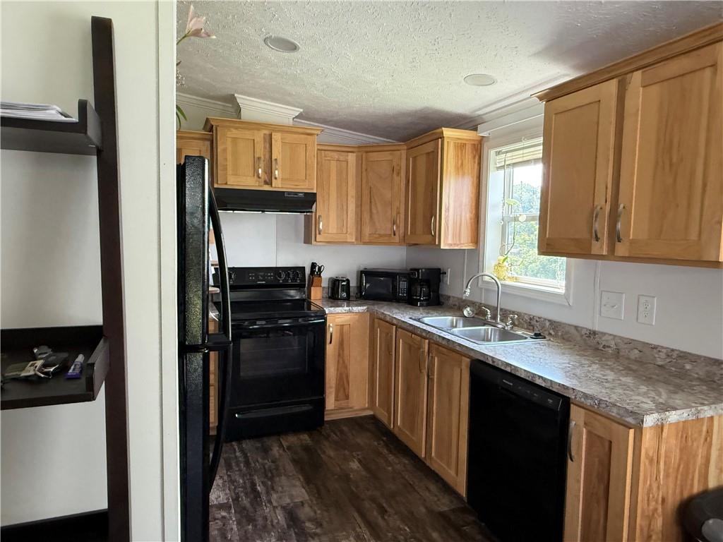 121 Rt 21 Mhp Carmichaels, PA 15320 - Photo 5 of 16 a kitchen with a sink stove and refrigerator