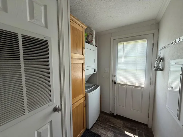 a bathroom with a granite countertop sink and a window