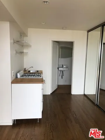 a view of kitchen island with wooden floor