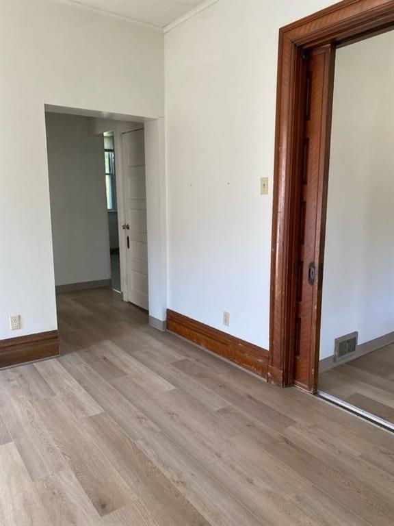 243 South Chestnut Street Pittsburgh, PA 15202 - Photo 7 of 19 an empty room with wooden floor and closet