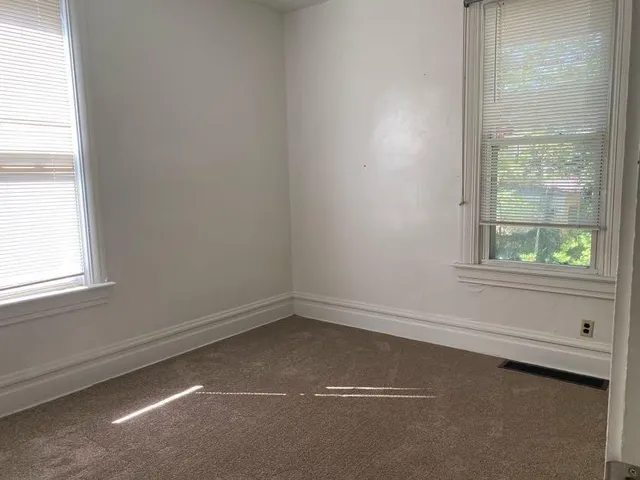 a kitchen with refrigerator and window