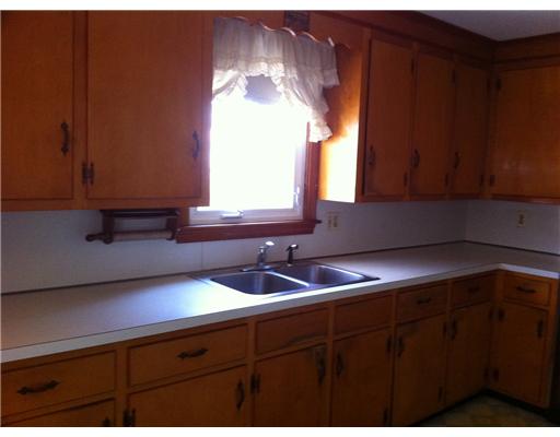 6 Asylum Road Warren, RI 02885 - Photo 5 of 6 Kitchen. LARGE EAT IN KITCHEN FEATURES ORIGINAL MAPLE CABINETS.