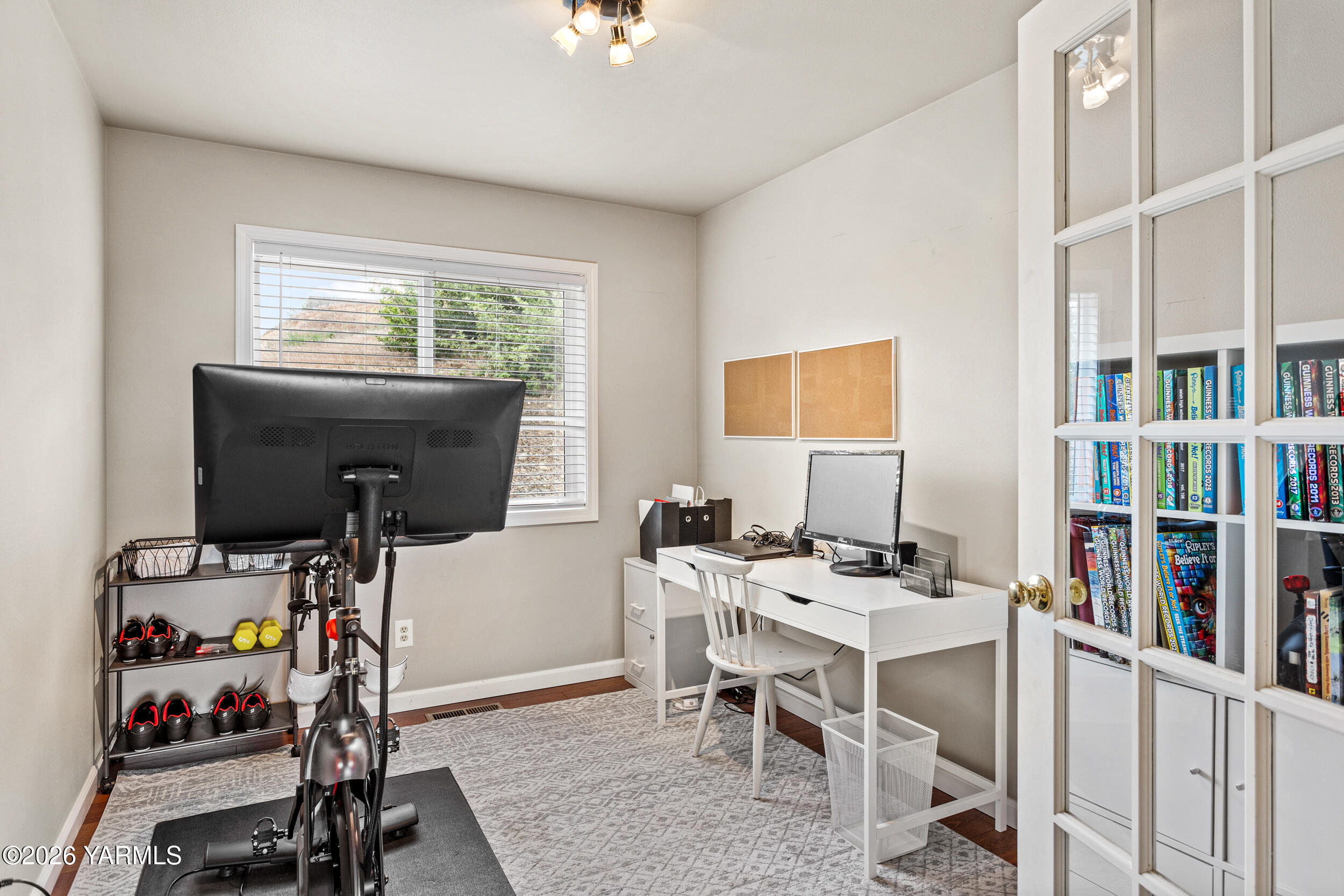 2121 Pleasant Hill Road Selah, WA 98942 - Photo 5 of 38 a view of a workspace with furniture and a window