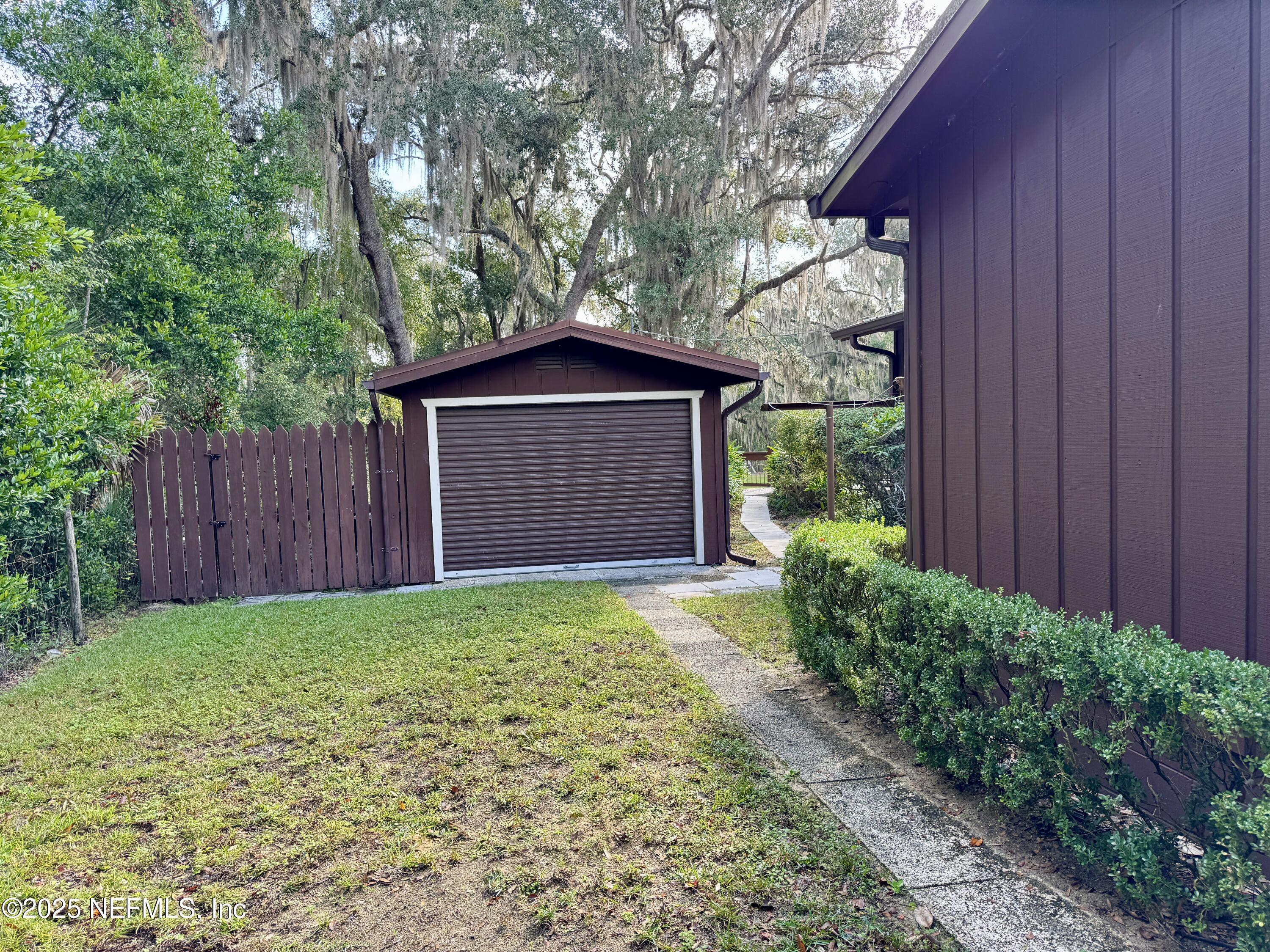 116 Francis Street Interlachen, FL 32148 - Photo 15 of 45 a tree in front of a wooden house