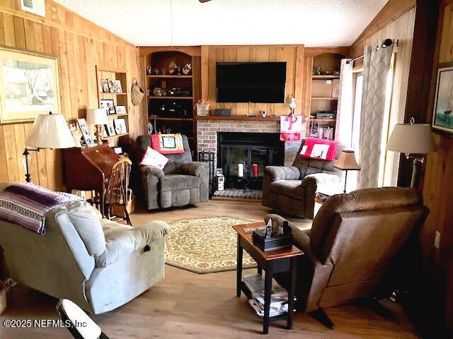 116 Francis Street Interlachen, FL 32148 - Photo 17 of 45 a living room with furniture a flat screen tv and a fireplace