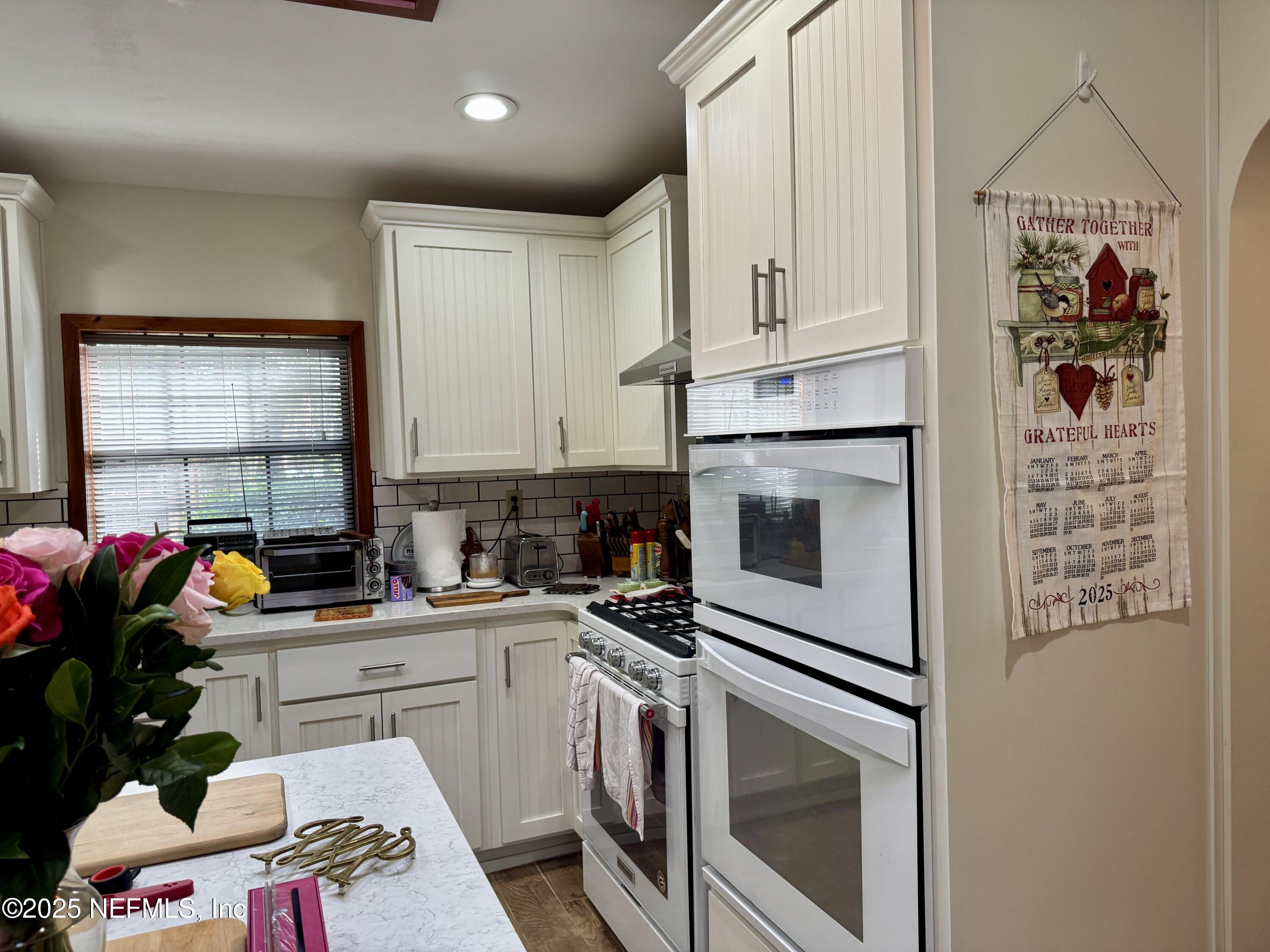 116 Francis Street Interlachen, FL 32148 - Photo 21 of 45 a kitchen with a sink cabinets and appliances
