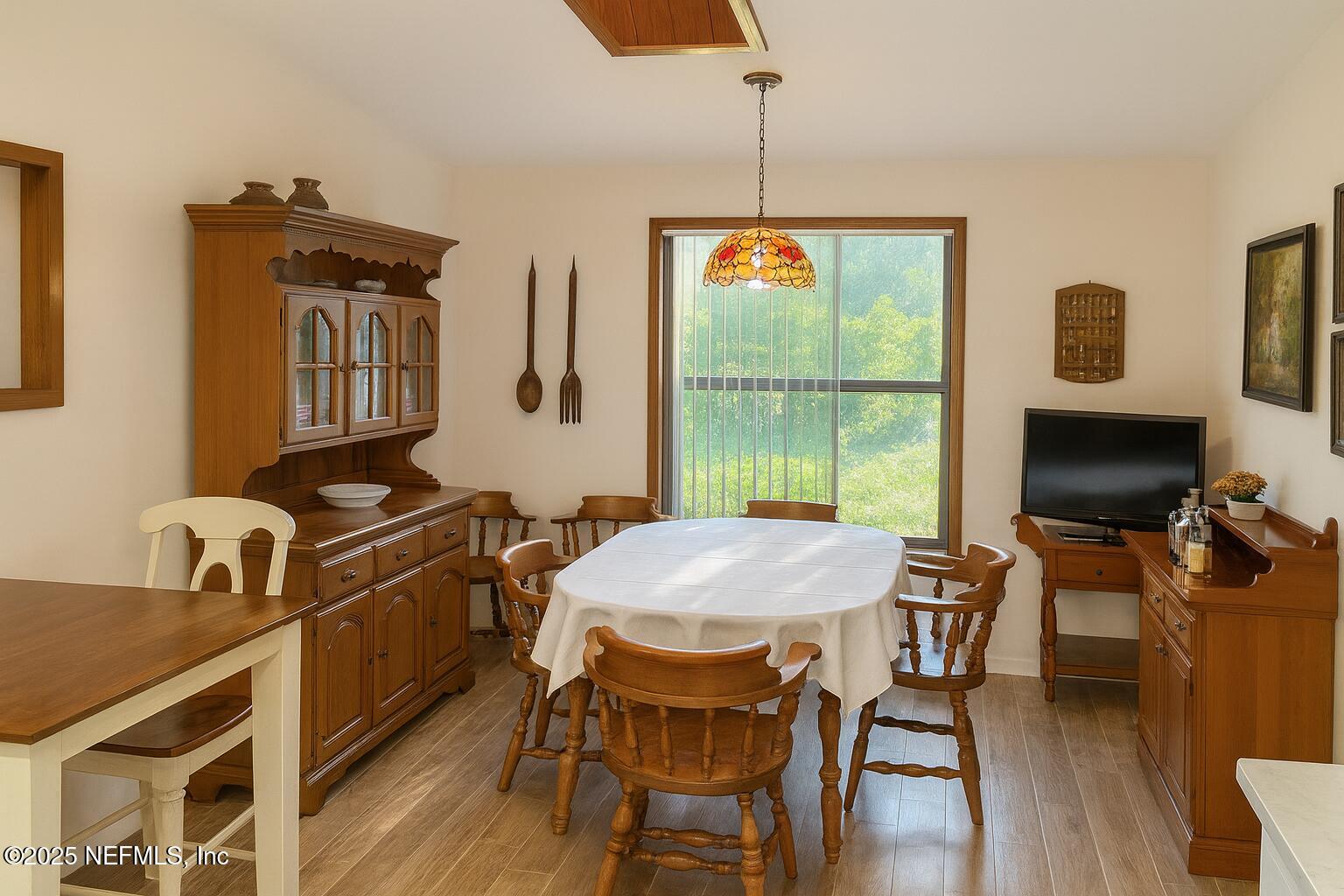 116 Francis Street Interlachen, FL 32148 - Photo 23 of 45 a view of a dining room with furniture window and wooden floor