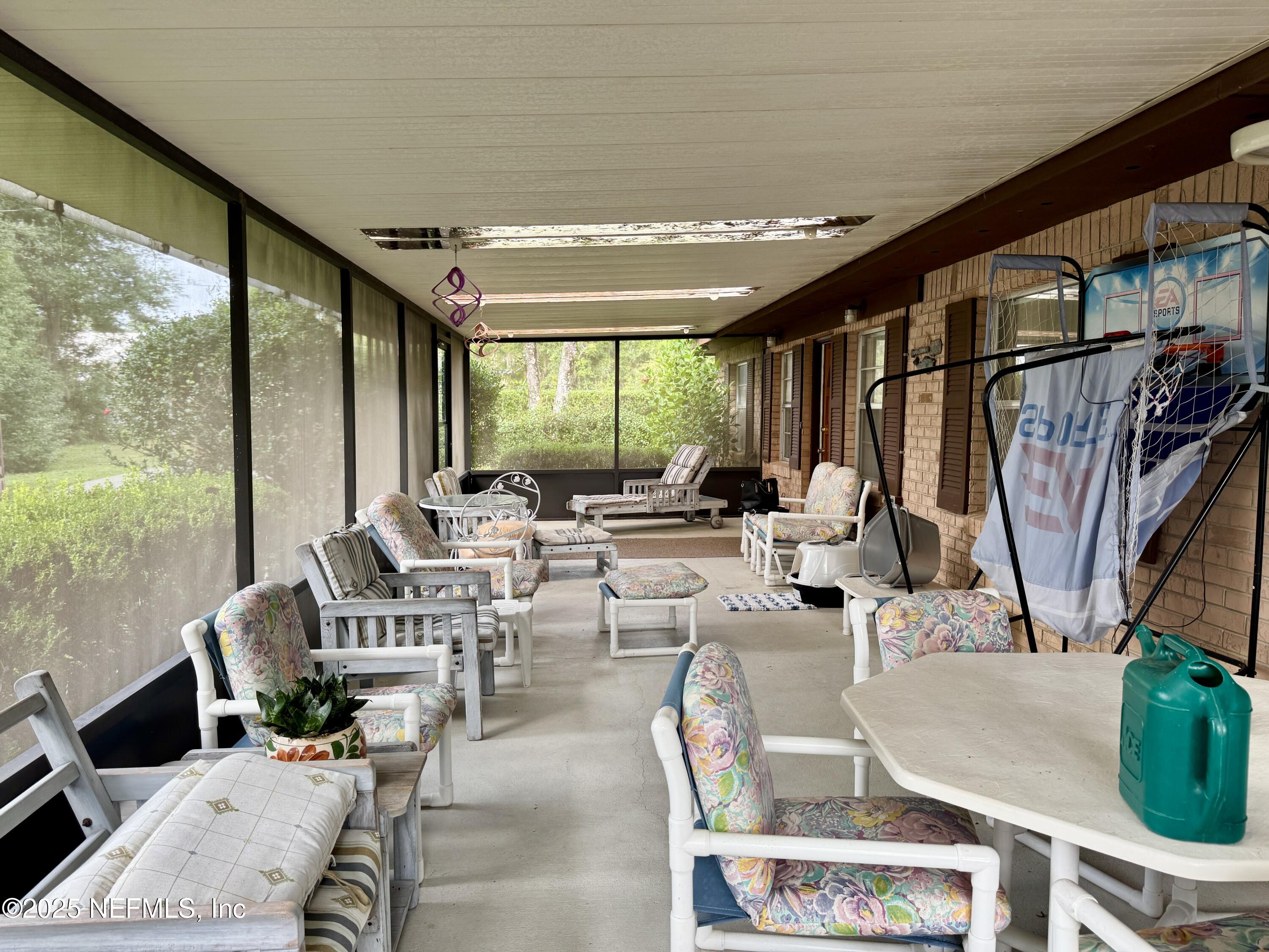 116 Francis Street Interlachen, FL 32148 - Photo 24 of 45 a very nice looking living room with a large window and a table