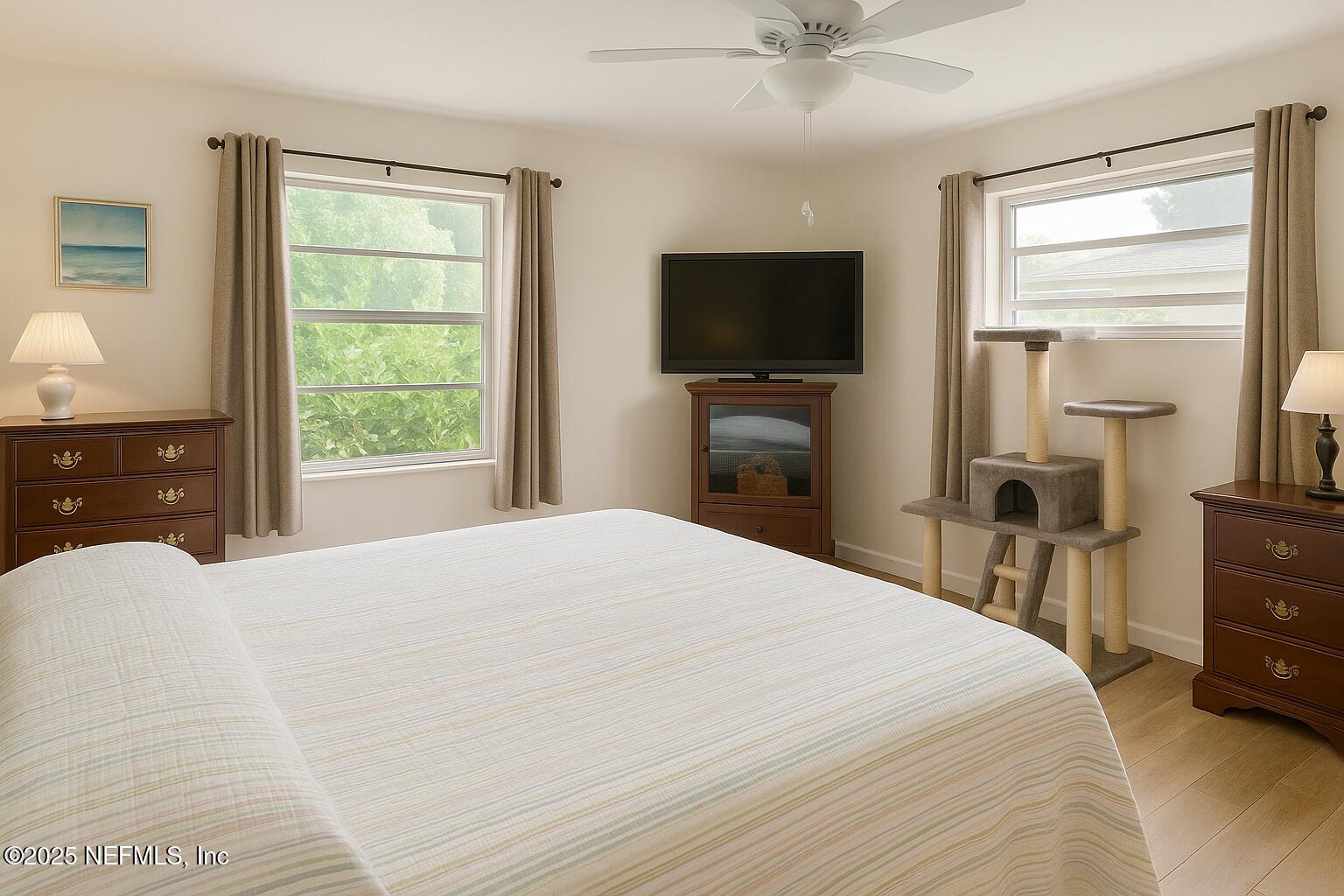 116 Francis Street Interlachen, FL 32148 - Photo 27 of 45 a bedroom with a bed and a flat tv screen on dresser