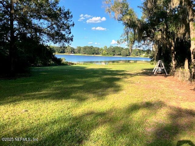 116 Francis Street Interlachen, FL 32148 - Photo 34 of 45 a view of a swimming pool and trees in the background