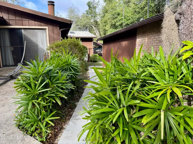 a backyard of a house with lots of green space