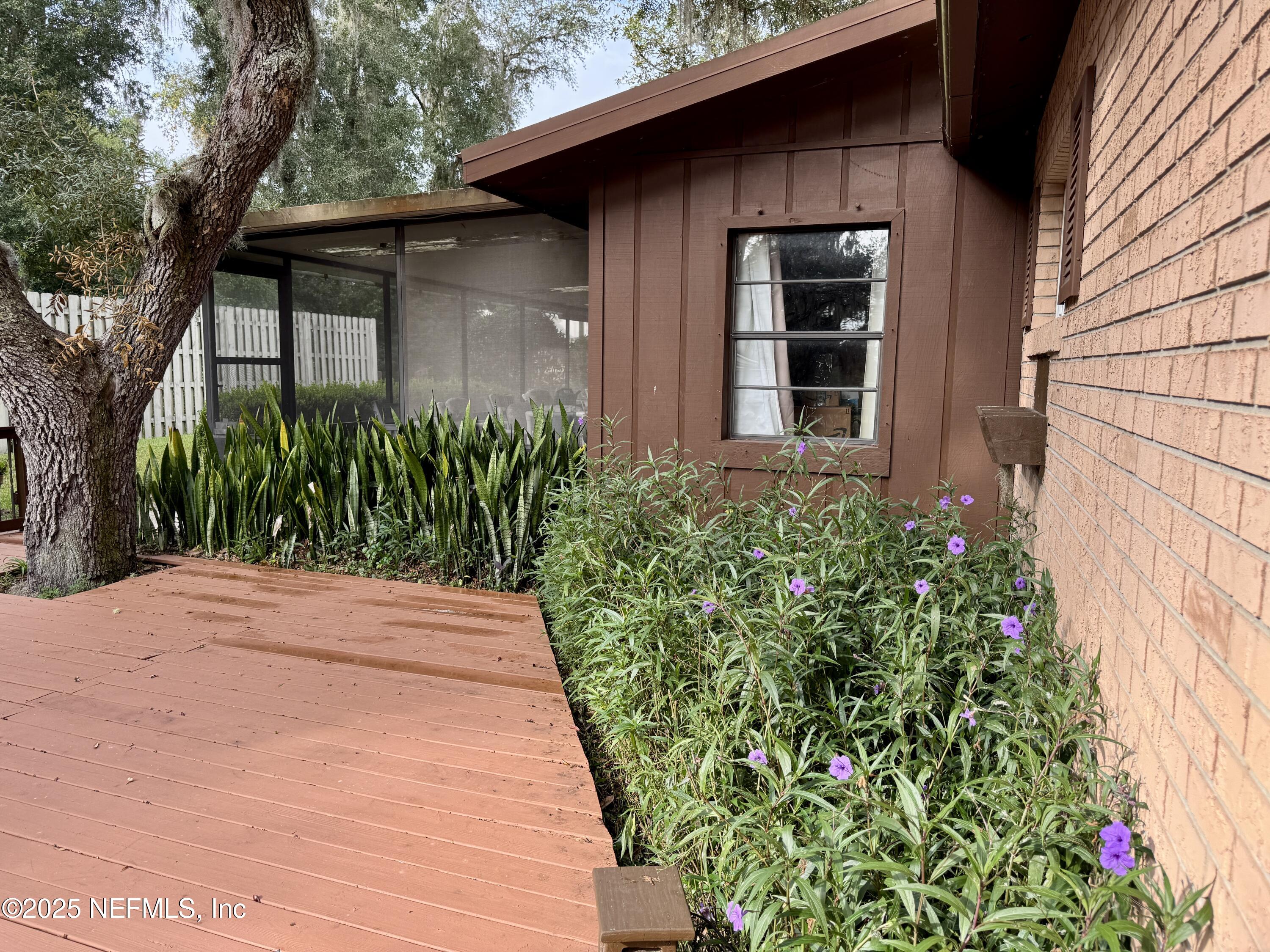 116 Francis Street Interlachen, FL 32148 - Photo 10 of 45 a front view of a house with garden