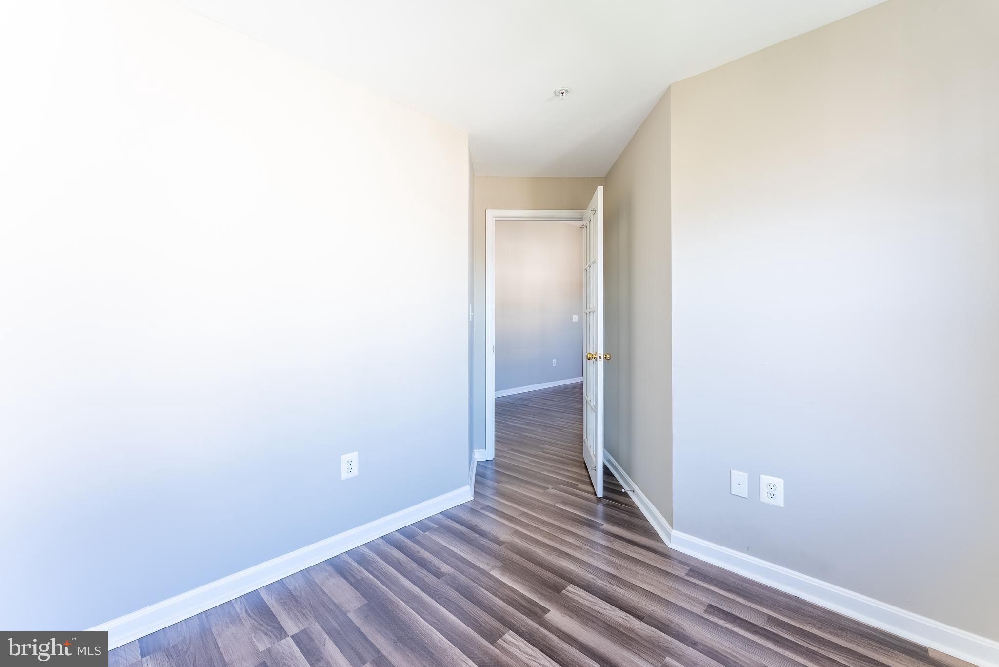 645 Constellation Square Southeast, Unit L Leesburg, VA 20175 - Photo 11 of 44 a view of a hallway with wooden floor