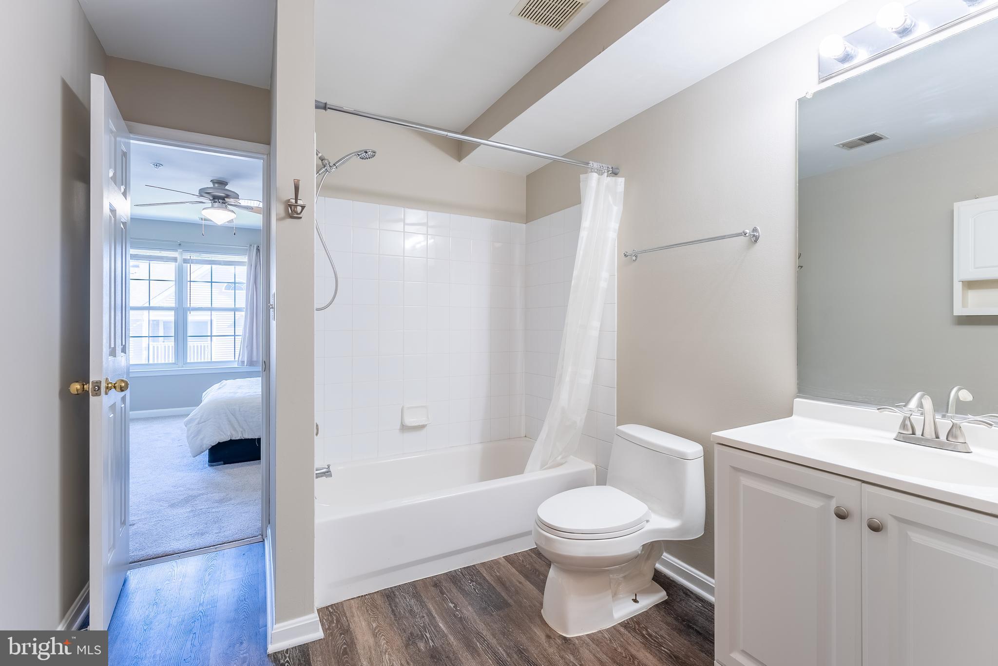 645 Constellation Square Southeast, Unit L Leesburg, VA 20175 - Photo 15 of 44 a bathroom with a toilet sink and shower