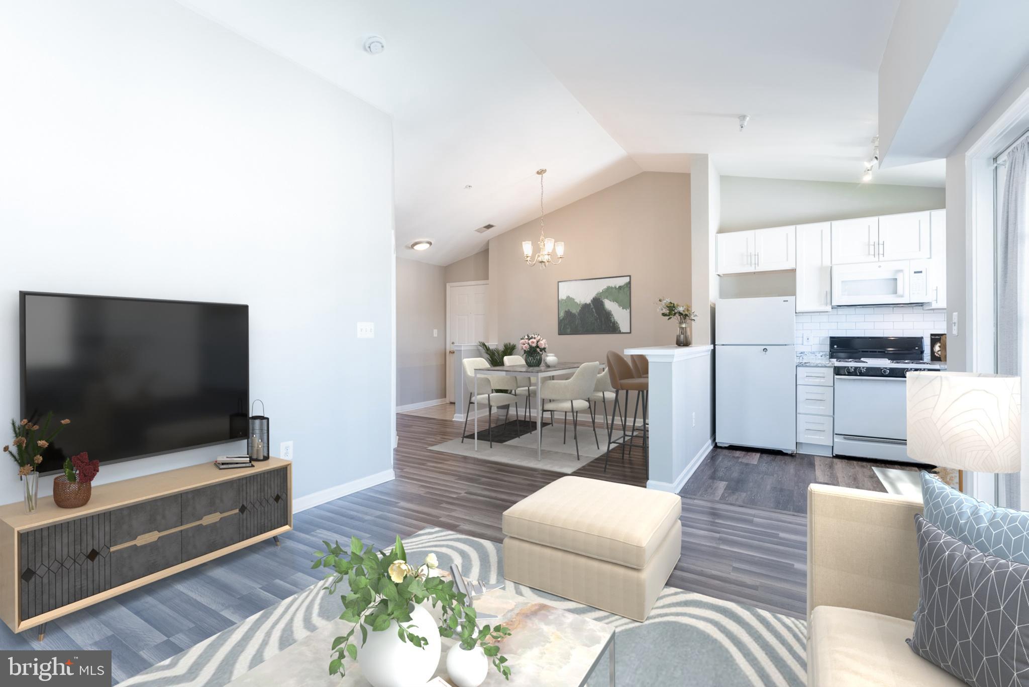 645 Constellation Square Southeast, Unit L Leesburg, VA 20175 - Photo 2 of 44 a living room with furniture and a flat screen tv