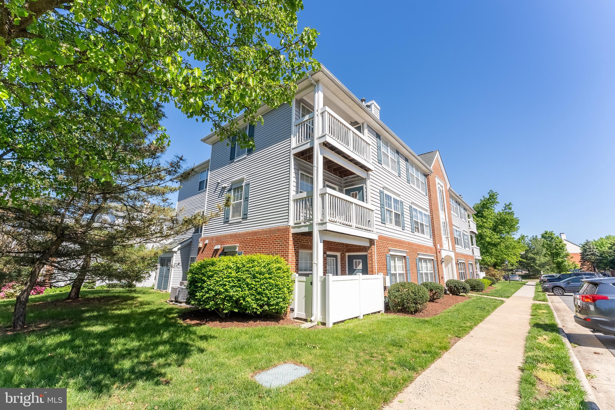645 Constellation Square Southeast, Unit L Leesburg, VA 20175 - Photo 30 of 44 a front view of a house with a yard