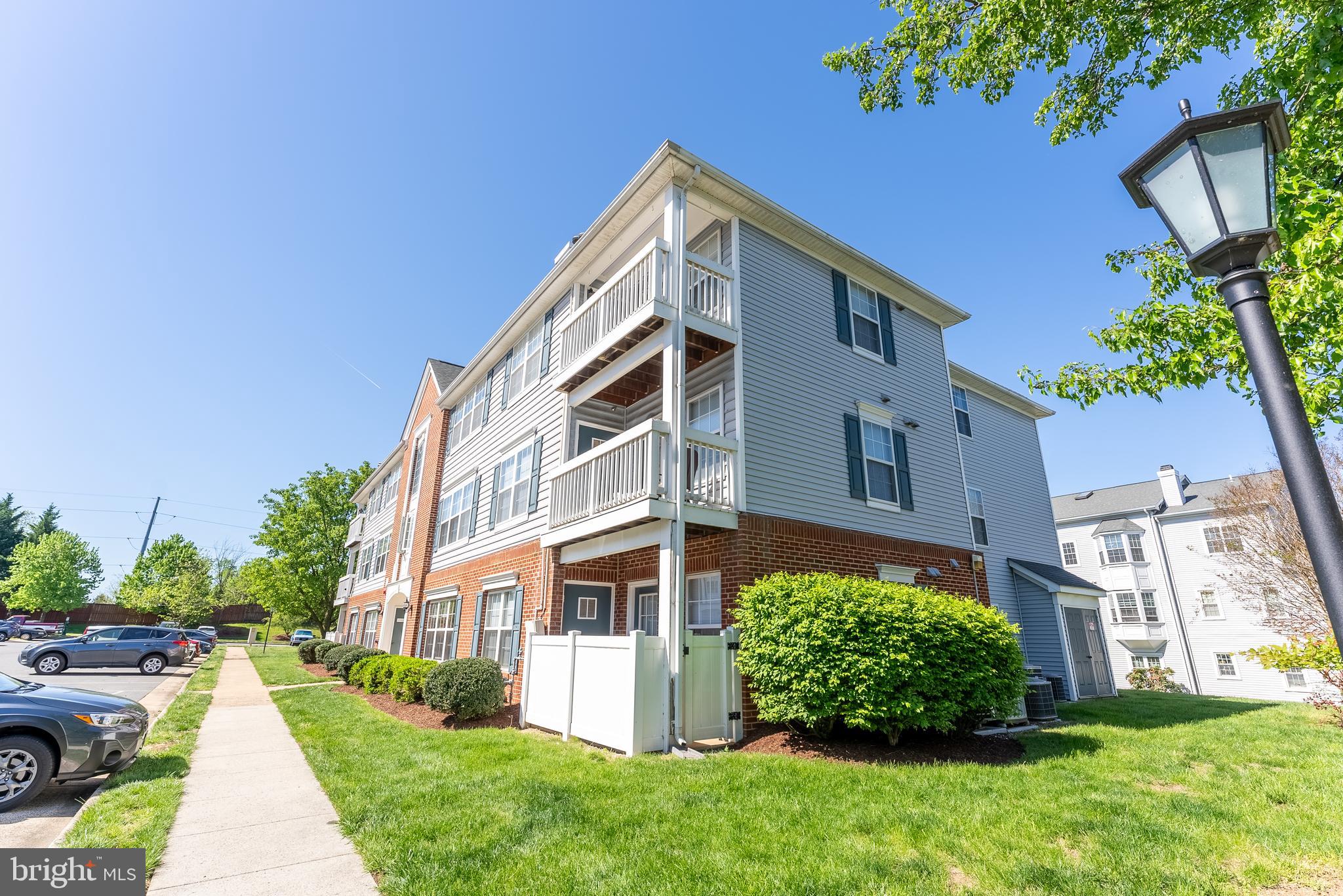645 Constellation Square Southeast, Unit L Leesburg, VA 20175 - Photo 31 of 44 front view of a house with a yard