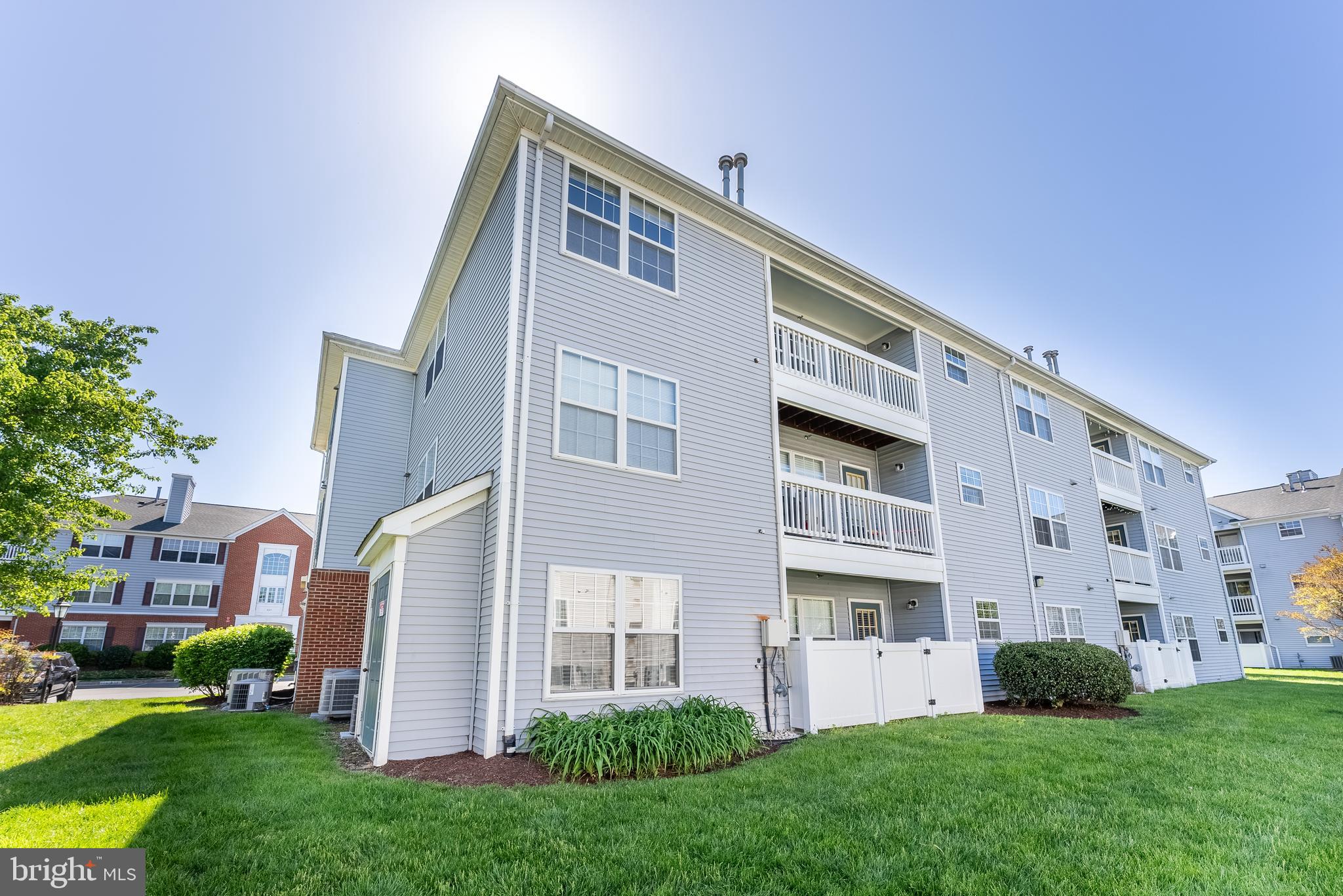 645 Constellation Square Southeast, Unit L Leesburg, VA 20175 - Photo 36 of 44 a front view of building with yard
