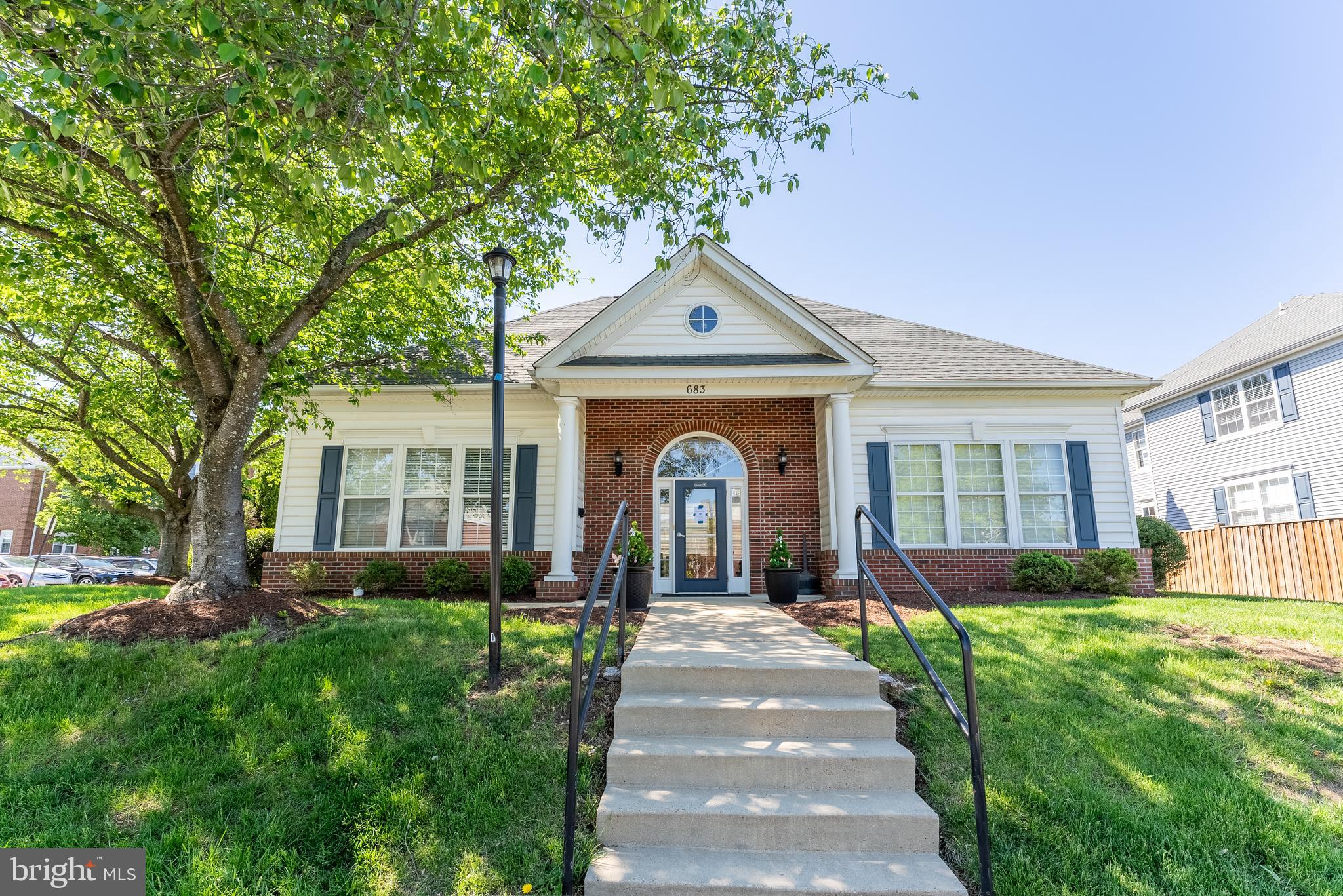645 Constellation Square Southeast, Unit L Leesburg, VA 20175 - Photo 39 of 44 a front view of a house with a yard