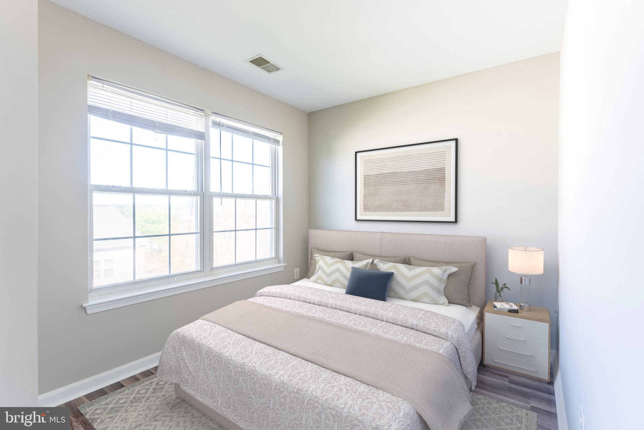 645 Constellation Square Southeast, Unit L Leesburg, VA 20175 - Photo 5 of 44 a bedroom with a bed and a window