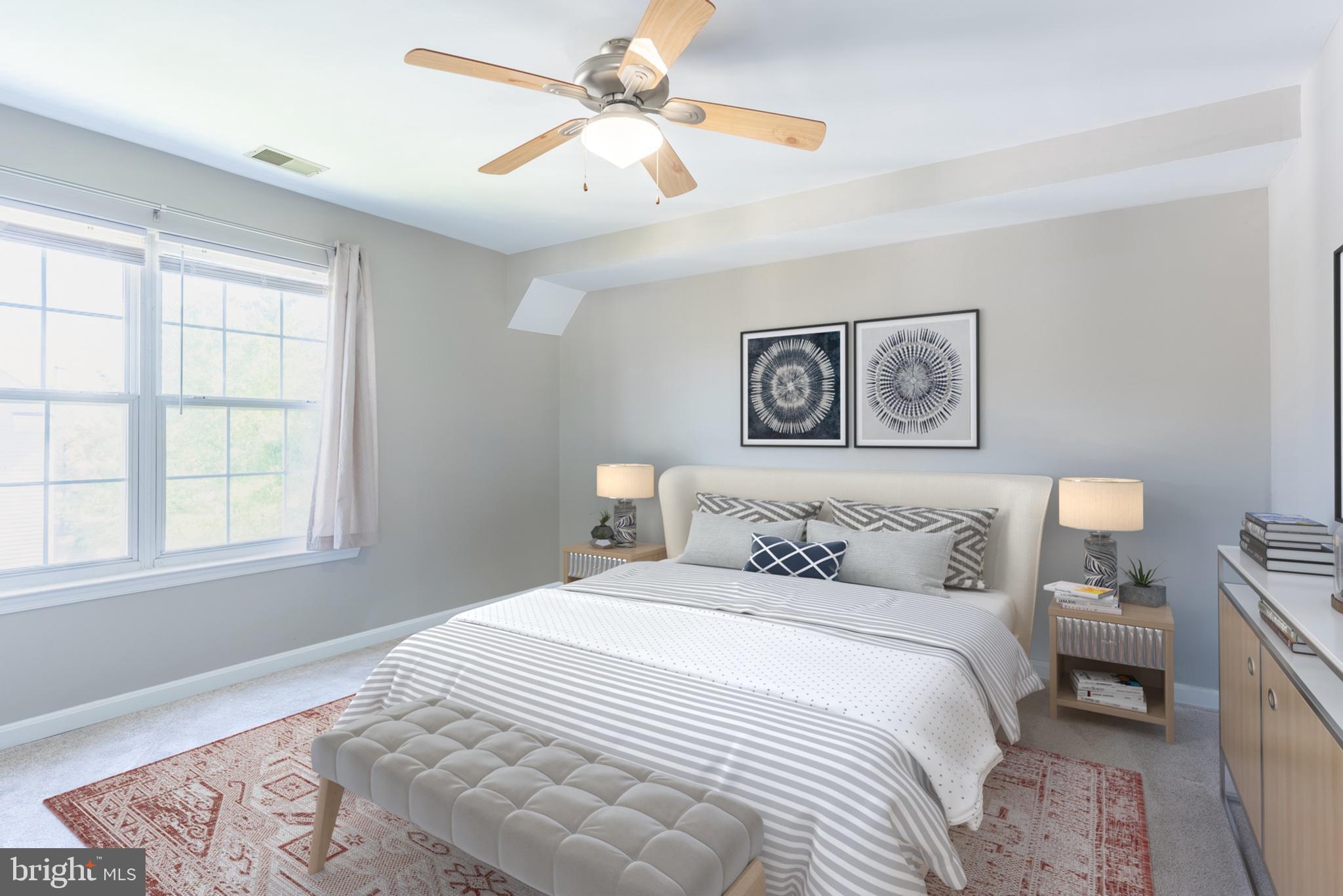 645 Constellation Square Southeast, Unit L Leesburg, VA 20175 - Photo 6 of 44 a bedroom with a large bed and a window