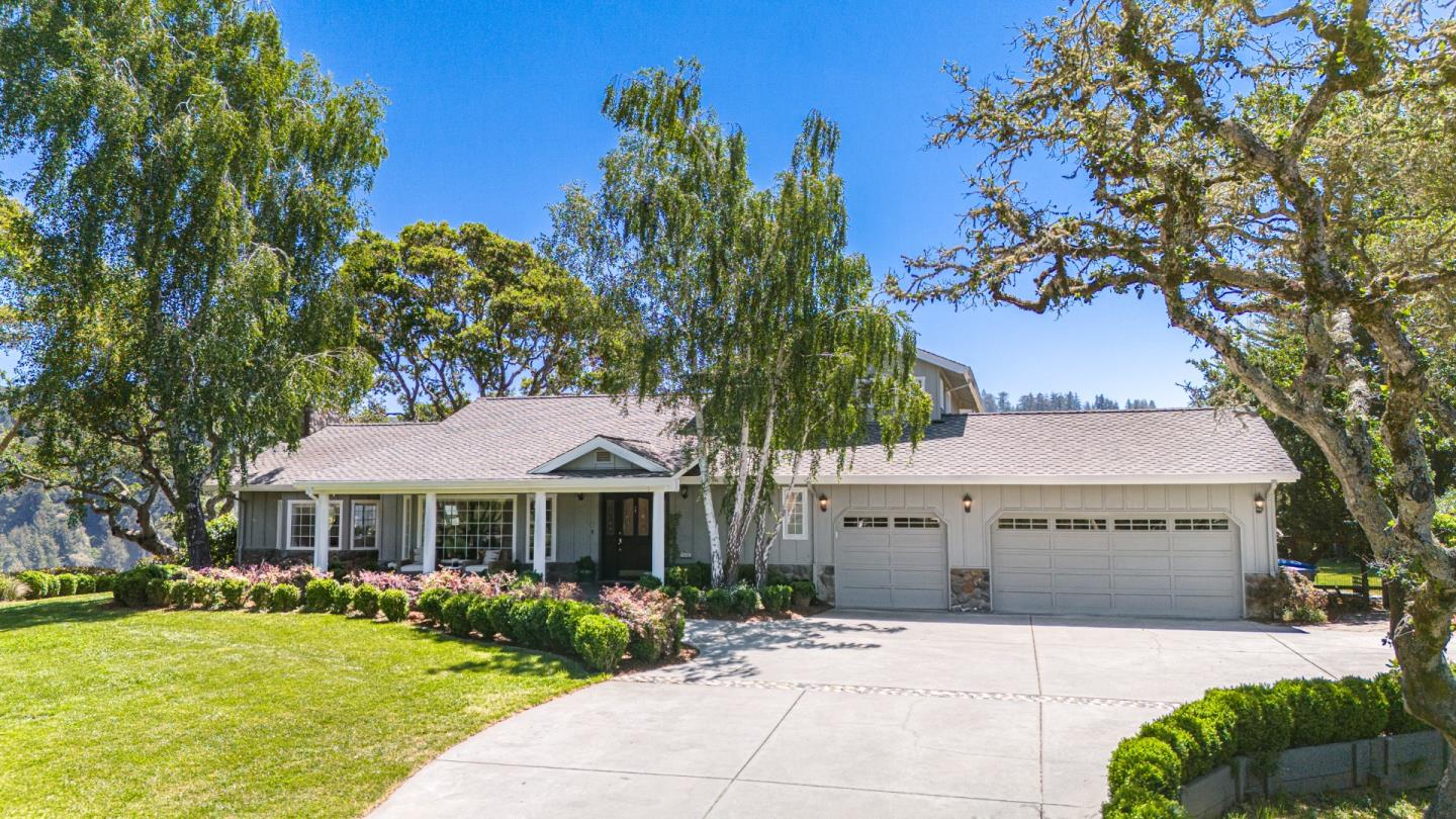 a front view of a building with garden