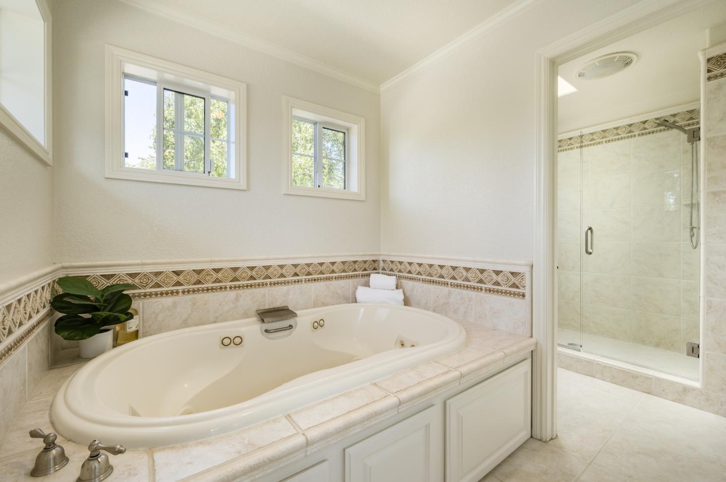 348 Los Robles Road Soquel, CA 95073 - Photo 26 of 87 a bathroom with a tub and a shower