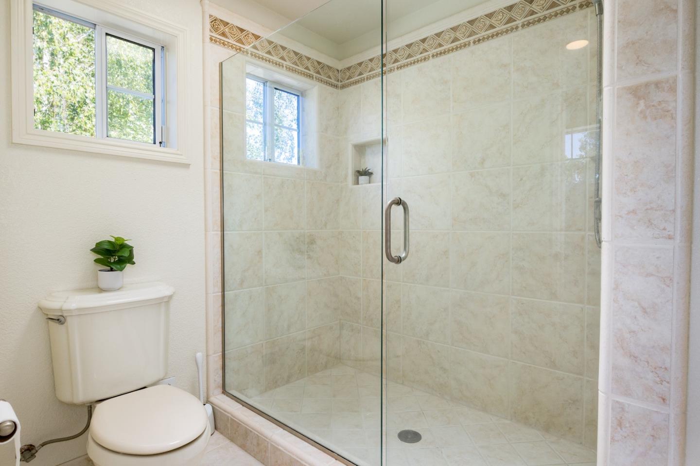 348 Los Robles Road Soquel, CA 95073 - Photo 27 of 87 a white toilet next to a bathroom shower