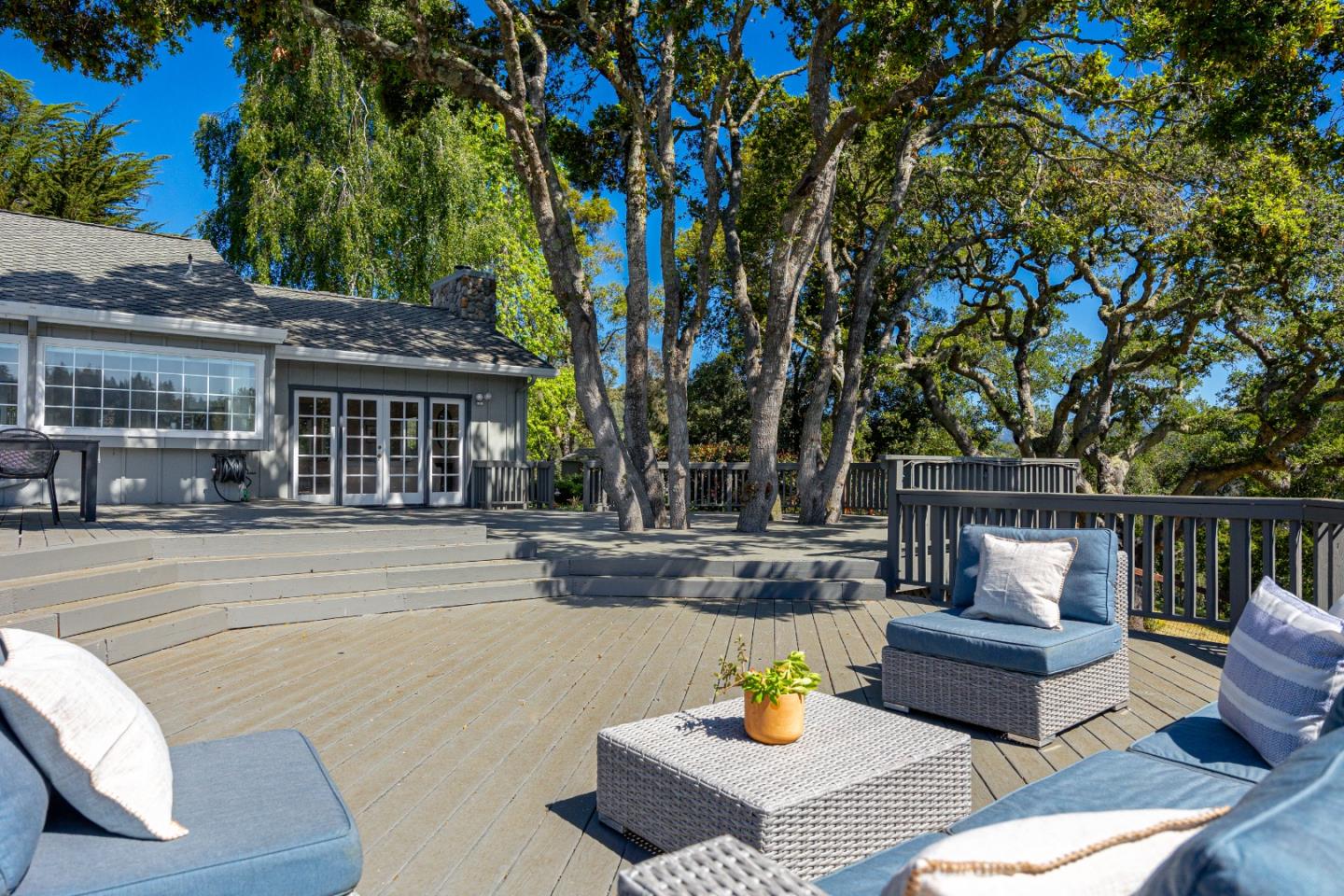348 Los Robles Road Soquel, CA 95073 - Photo 40 of 87 a view of a patio with couches and a fire pit and wooden fence