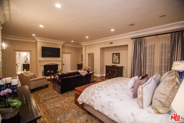 a living room with furniture fireplace and flat screen tv