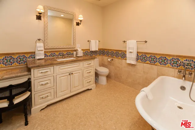 a bathroom with a double vanity sink and a bathtub