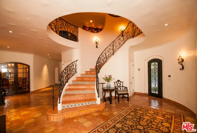 a view of entryway and hall with dining area