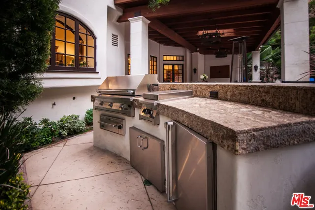 a kitchen with a stove and a sink
