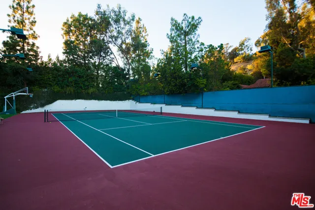 a view of an outdoor space and basketball court