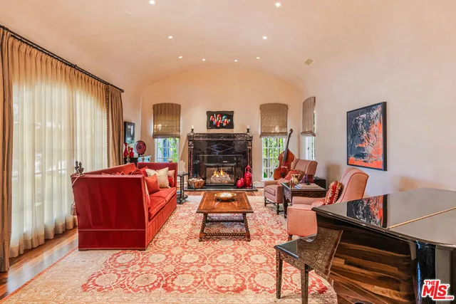 a living room with fireplace furniture and a fireplace