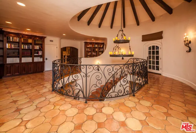 a view of a livingroom with furniture and staircase