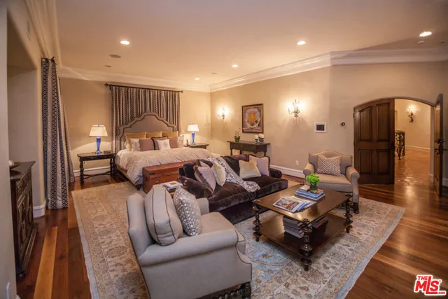 a living room with furniture and a glass door