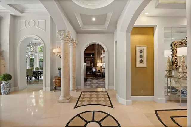 a kitchen with a sink and a clock
