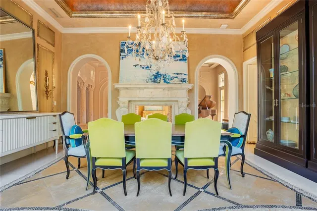 a living room with fireplace a flat screen tv and a large window