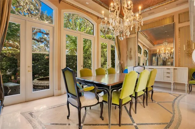 a spacious bedroom with bed and a chandelier