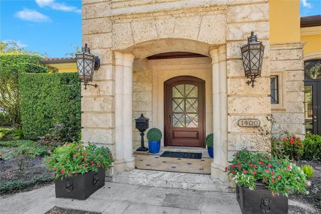 a view of a balcony with chairs and wooden floor